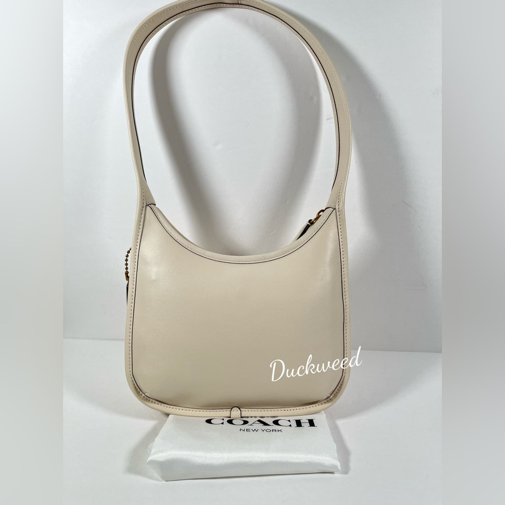 Sold ❌Coach Curve Zip Shoulder Bag in Brass/Chalk Glovetanned Leather NWT